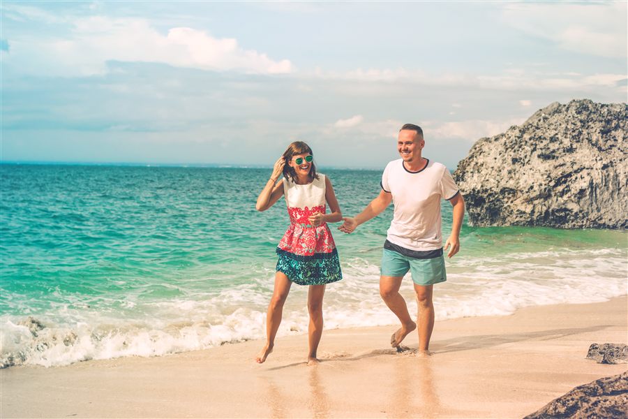 Couple enjoying tropical beach vacation