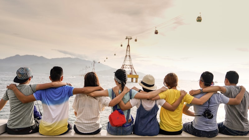 Friends celebrating together by the ocean